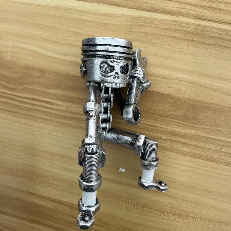 Piston Skull Resin Sculpture with Wrench Legs: Industrial Tabletop Decor for Car Enthusiasts
